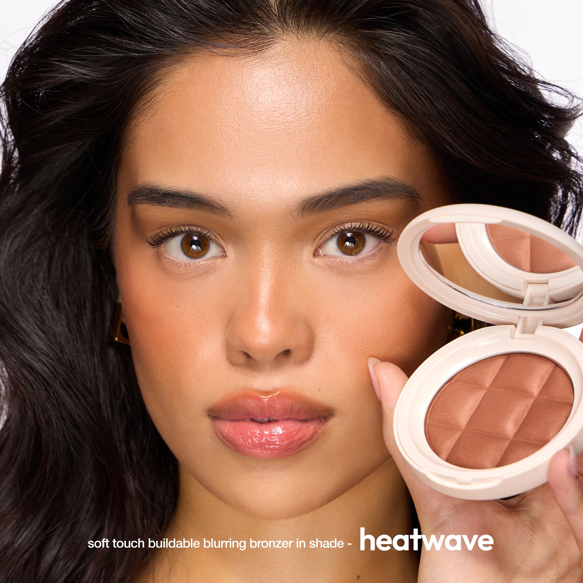 ICONIC London Fridays Buildable Blurring Bronze. Model wearing bronzer